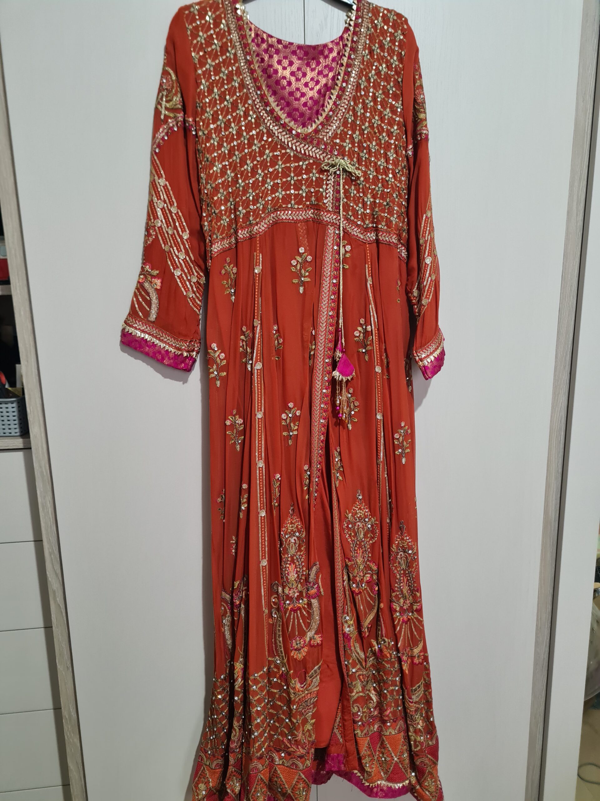 Beautiful terracotta embellished long dress with matching trousers and dupatta